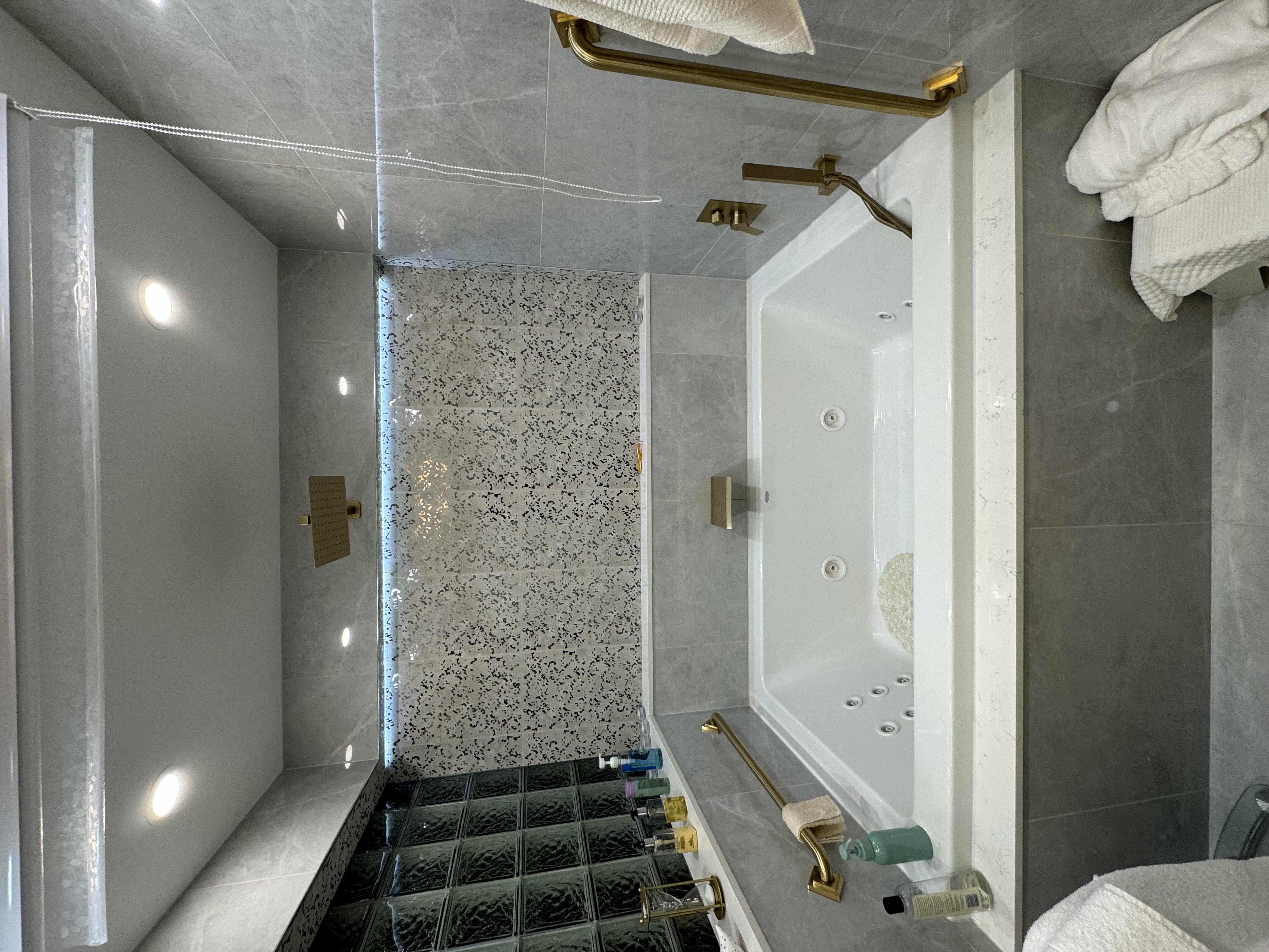 Drop-in tub, mosaic wall