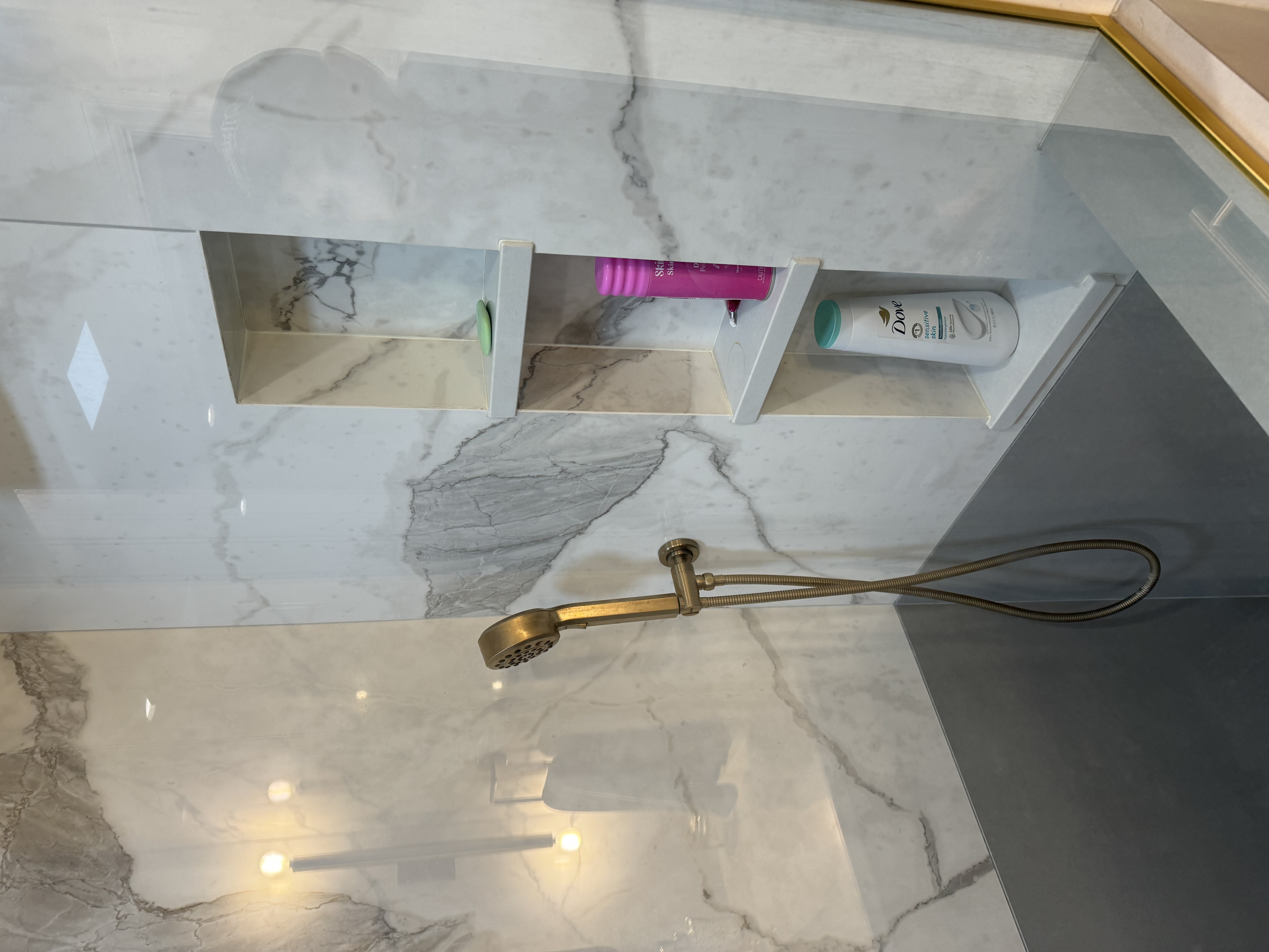Brass hardware, marble niche